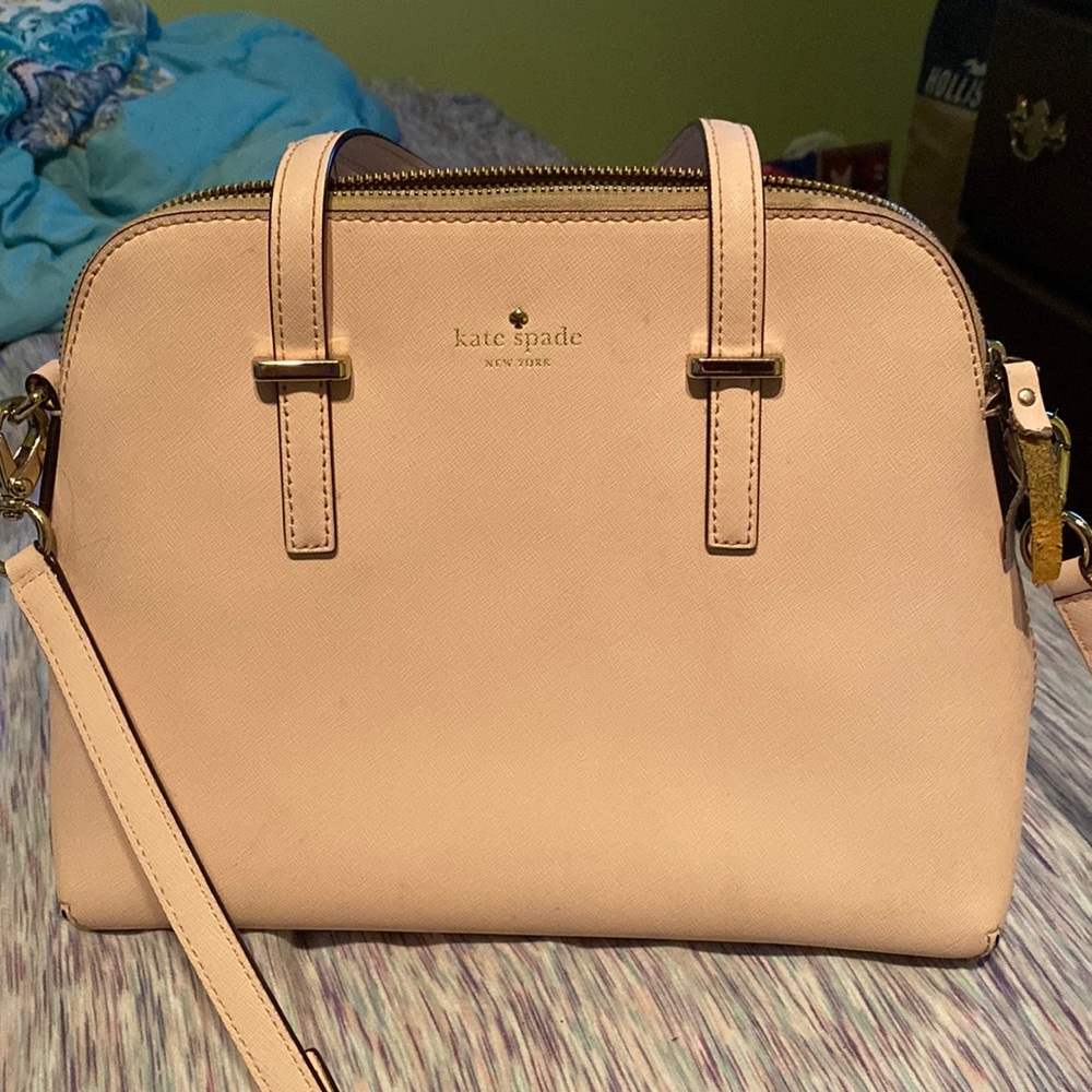 Kate Spade light pink purse with strap.